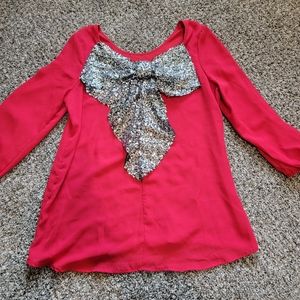 Sheer red long sleeve with big silver sequin bow on back!